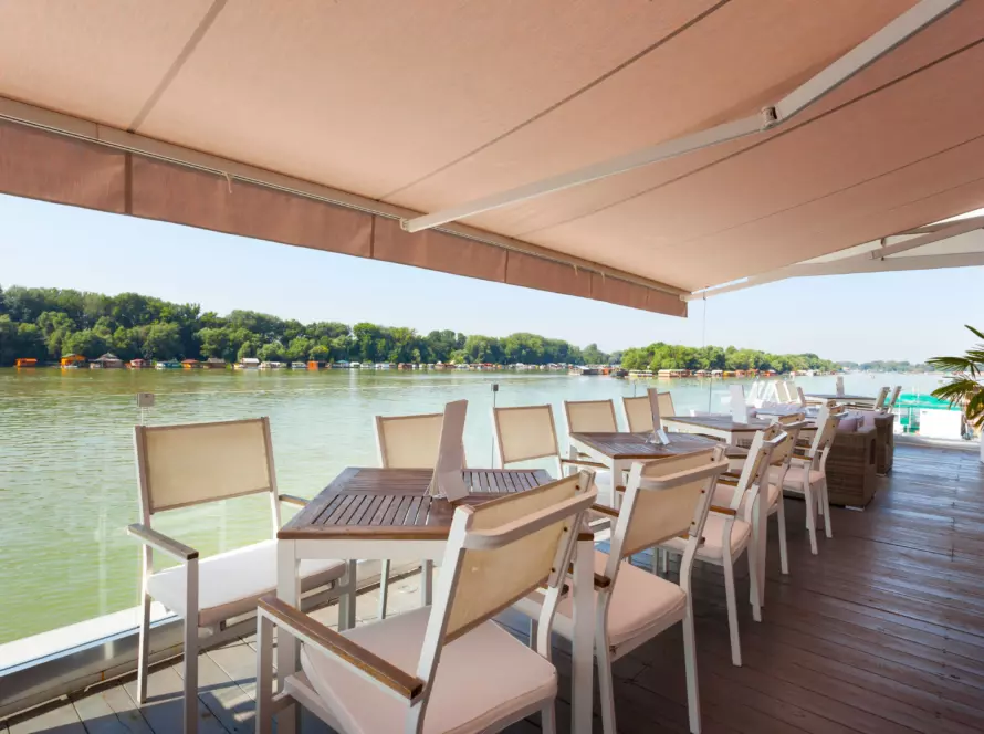 Modern Awnings at riverside cafe terrace manufactured by JP Blinds