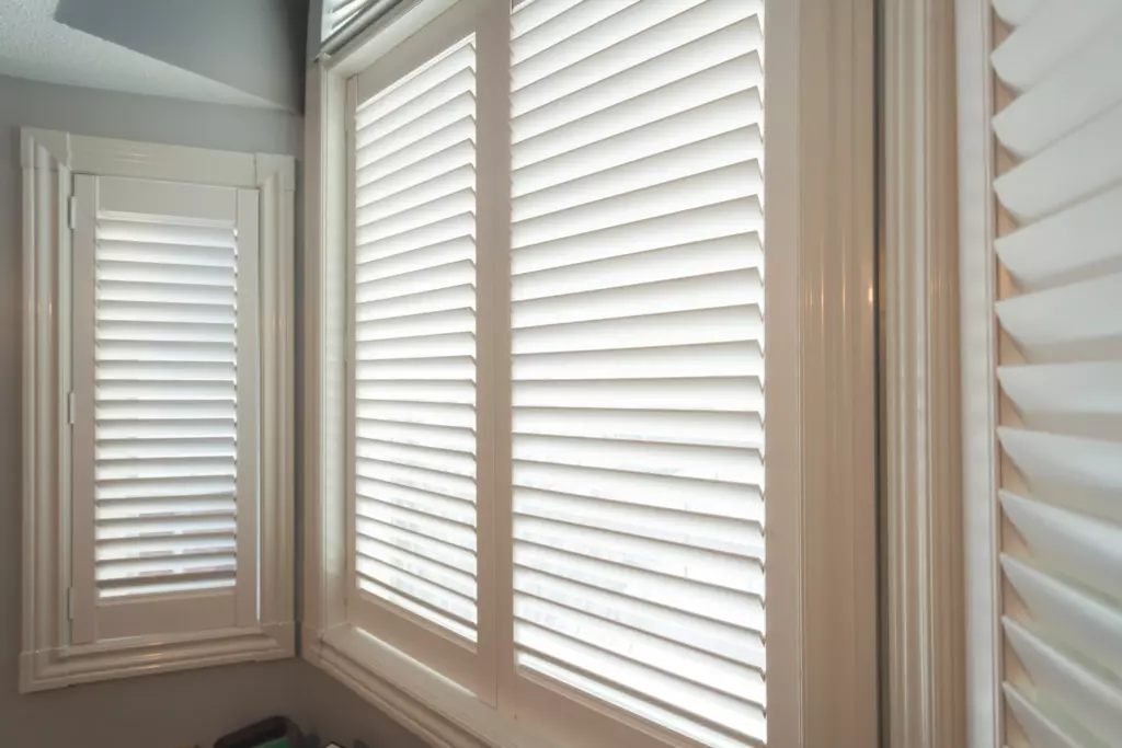 close up of an open window with shutters from jp blinds